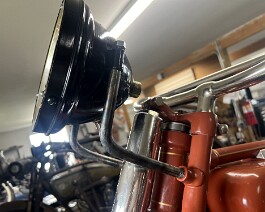 Factory light (minus rim) restored and attached with brackets.